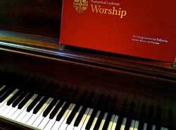 Lutheran Book of Worship and piano keyboard