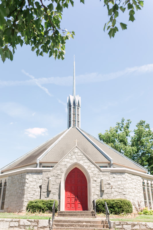 Red front door of St. John's Lutheran Church
